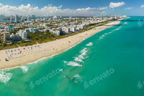 Preview: Travel destination in United States. South Beach sandy surface with tourists