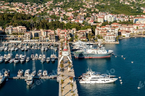 Preview: High angle shot of boats near the dock and buildings on the shore in Porto Montenegro, Kotor