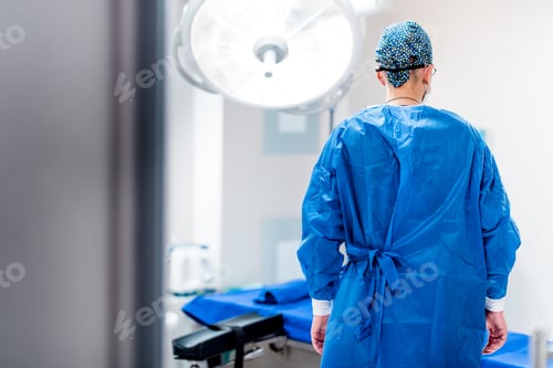 Preview: Portrait of surgeon in operating room of hospital. Getting ready for surgery