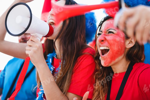Preview: Crazy sport fans screaming while supporting their team - Focus on right girl eye