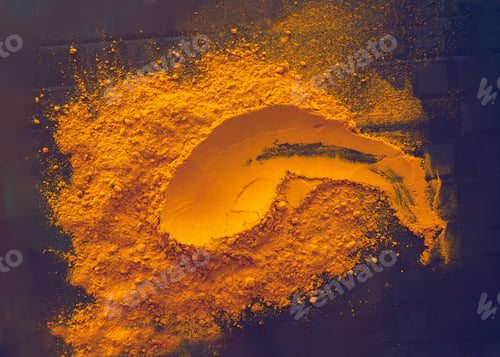 Preview: Turmeric powder on blue background toned in violet
