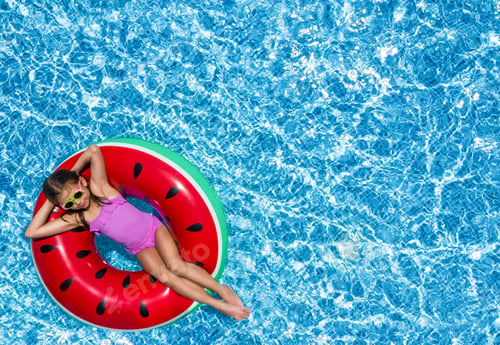 Preview: Cute little girl with inflatable ring in swimming pool, top view. Space for text