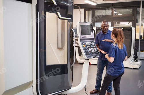 Preview: Engineer Showing Apprentice How To Use CNC Tool Making Machine