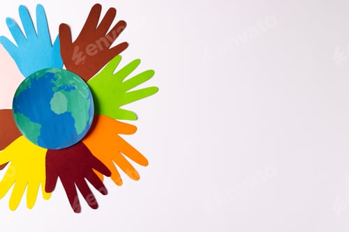 Preview: Paper cut out of multi coloured hands and globe with copy space on white background