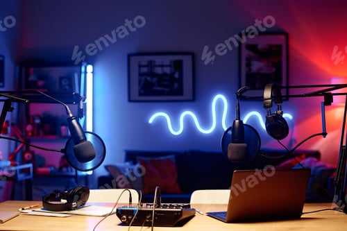 Preview: Laptop surrounded by microphones with headphones and soundboard
