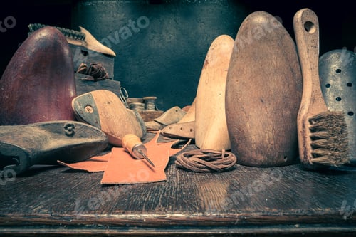 Preview: Traditional cobbler workplace with tools, strap, leather and rules.