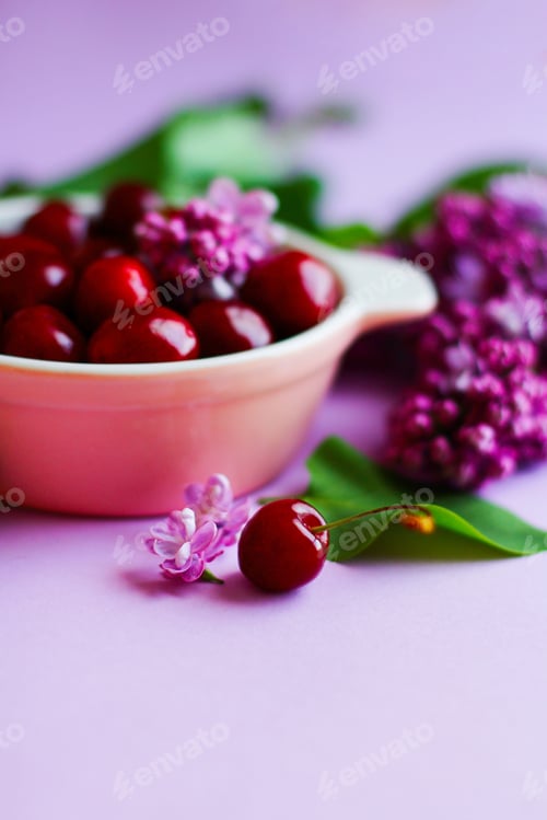 Preview: Sweet Cherries and Delicate Purple Flowers Arrangement