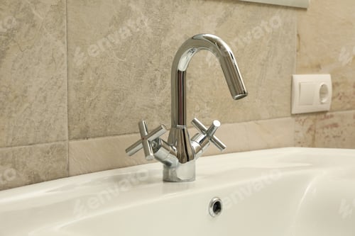 Preview: Sink and faucet in modern bathroom, close up