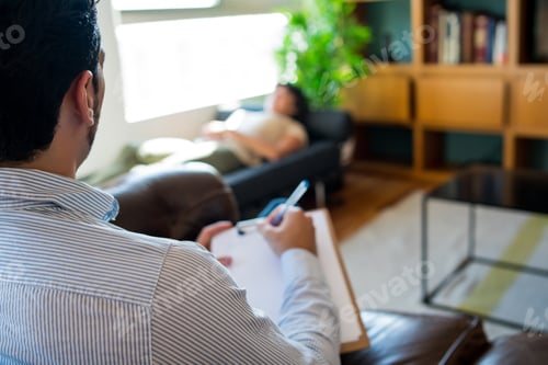 Preview: Psychologist talking with patient on therapy session.