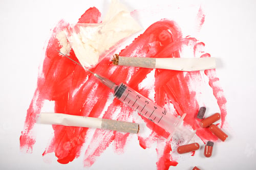 Preview: Drugs Syringe Pills And Cigarette Lie On The Table