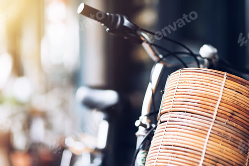 Preview: Summery transport. Cropped shot of a black bicycle parked on a street. Copy space on the left side