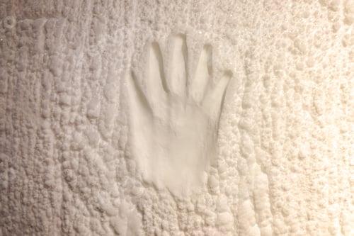 Preview: Footprint of a human hand on the ice.