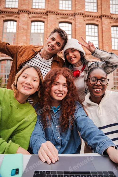 Preview: Vertical portrait of a group of friends having fun and smiling together. High school students