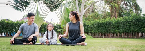 Preview: Family Asian parent and child daughter preparing to play yoga together at home garden.