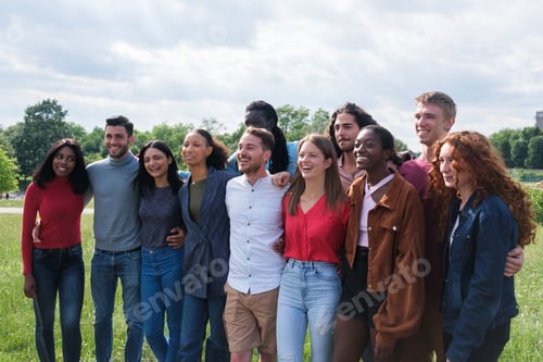 Preview: Group of young people from different cultures together spending an afternoon in the park