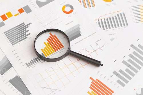 Preview: Business graphs, charts and magnifying glass on table. Financial development