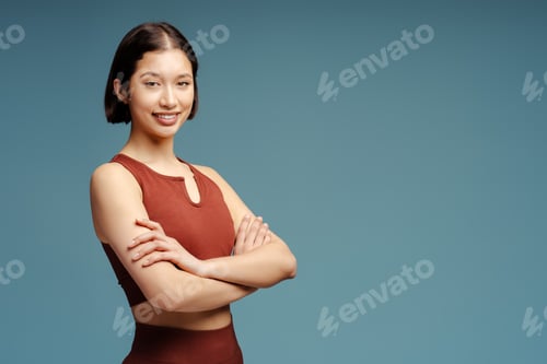 Preview: Happy smiling sports woman wearing fitness uniform, posing for picture isolated