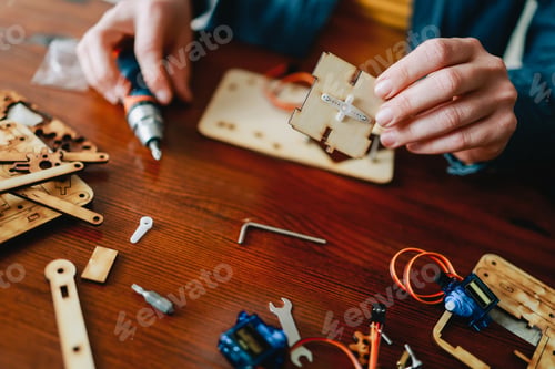 Preview: Robotic school project: Student building robot at AI programming class - education