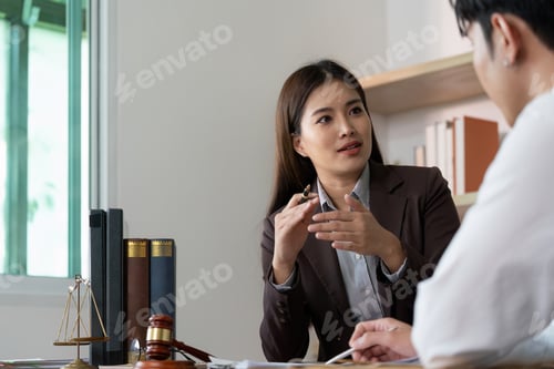 Preview: Legal Advice. A lawyer providing guidance to a client in a modern office.