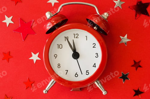 Preview: Festive Christmas background with alarm clock on red background in minimal style.