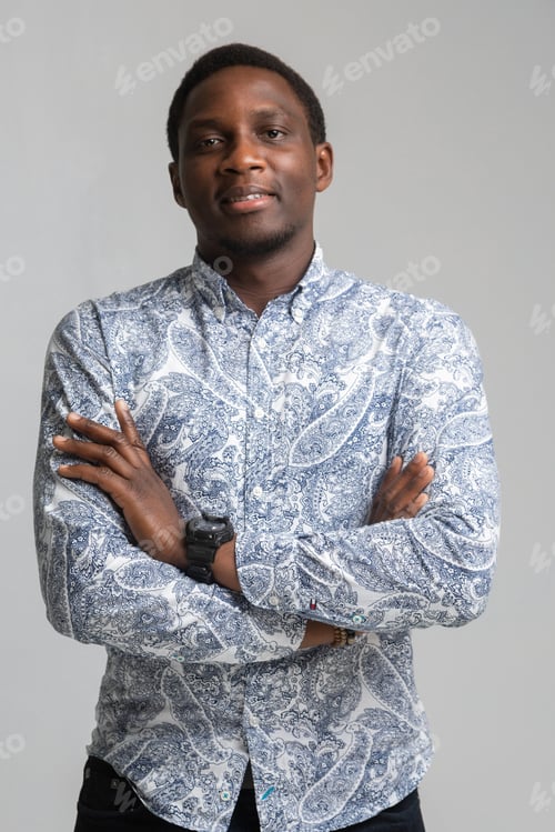 Preview: portrait of black young man standing with bent arms isolated on white background