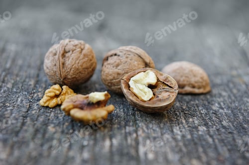 Preview: Walnuts at old wooden plank