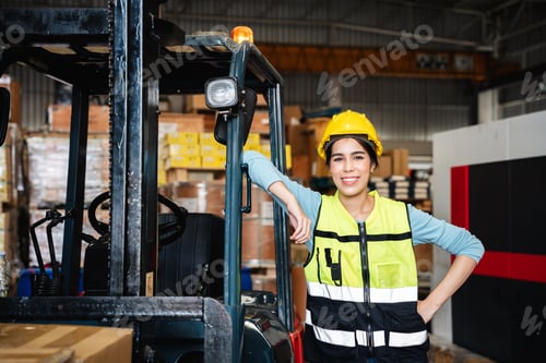 Preview: Portrait of a Happy warehouse worker in a warehouse or storehouse while looking at camera.