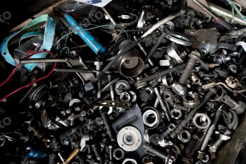 Preview: A disorganized assortment of metal tools and hardware components.