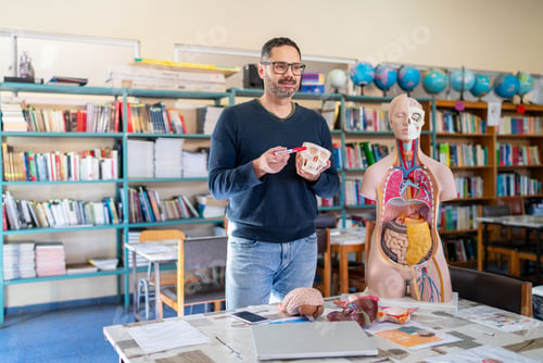 Preview: Teacher explaining human anatomy using skull and organ models