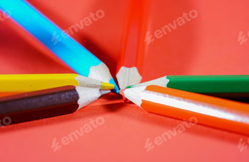 Preview: Set of colorful pencils on red background