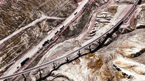 Preview: Aerial scenic view of a mountain highway winding across the Gobi desert in Qinghai Province, China