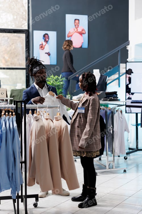 Preview: Boutique worker helping stylish customer