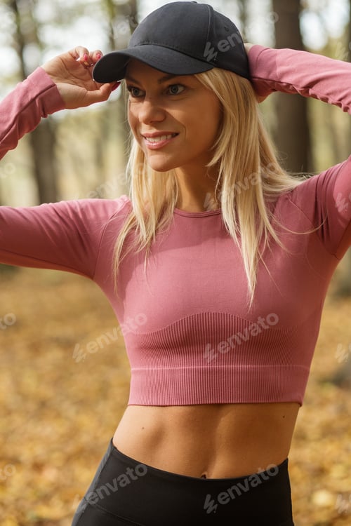 Preview: Woman goes in for sports outdoors. Concept of sports and healthy lifestyle. Autumn season.