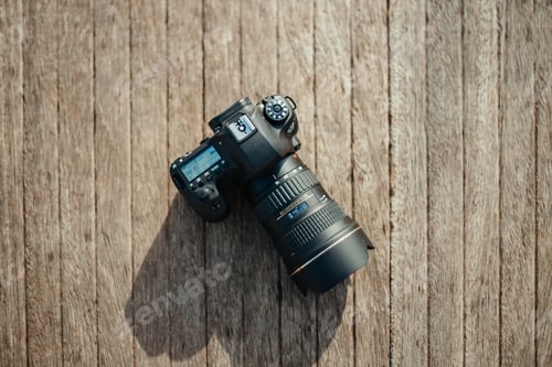 Preview: Photo camera on lumber surface