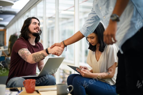 Preview: Ive always been eager to work with you. Shot of businesspeople shaking hands in an office.