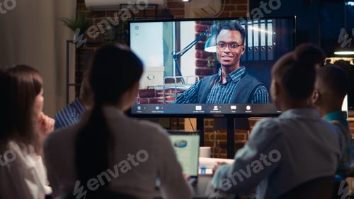 Preview: Remote team leader listening to employees report in videocall