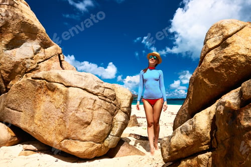 Preview: Woman At Beautiful Beach Wearing Rash Guard. Seychelles, Curieuse Island