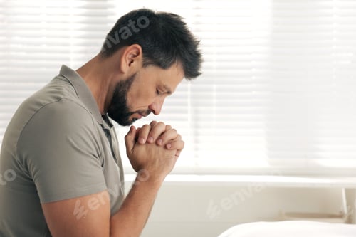 Preview: Religious man praying indoors. Space for text