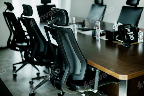 Preview: Empty conference room with black chairs and wooden table