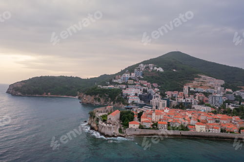 Preview: Old medieval town stone houses with red roofs and church bell towers. Budva is the center of tourism