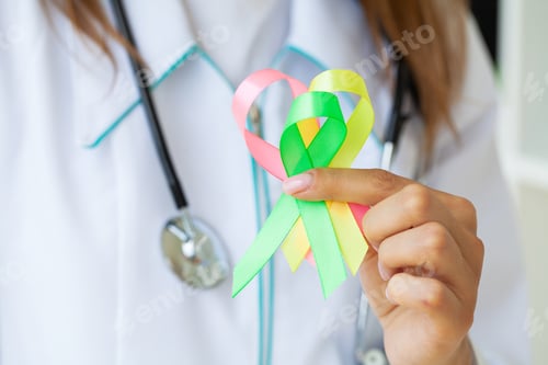 Preview: Female doctor holds colored ribbons symbolize awareness of various diseases