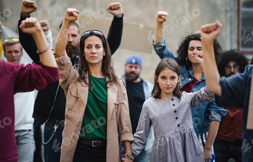 Preview: Group of people activists protesting on streets, strike and demonstration concept.
