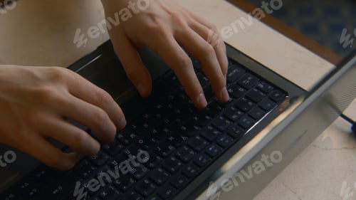 Preview: Close-up of man typing on keyboard. Stock footage. Man types beautifully with his hands on laptop