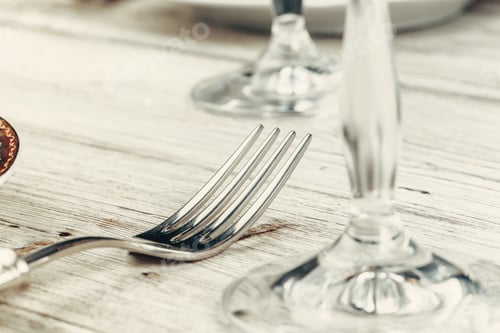 Preview: Close up shot of table setting for fine dining with cutlery and glassware