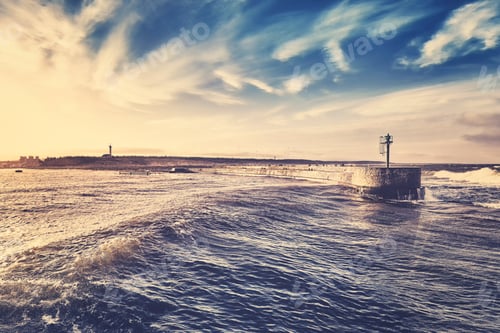 Preview: Retro stylized sunset over port entrance.