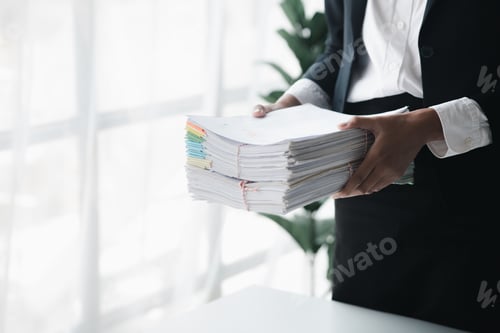 Preview: Businessman holding a lot of documents, corporate financial documents.