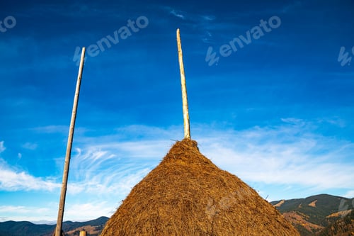 Preview: A large haystack against the backdrop of the wonderful nature of the Carpathians and the
