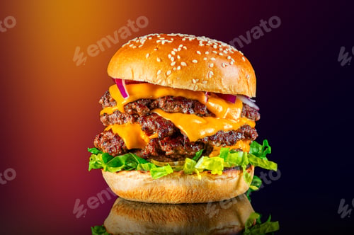 Preview: Closeup view of a tasty tower Cheeseburger isolated on a blurry background