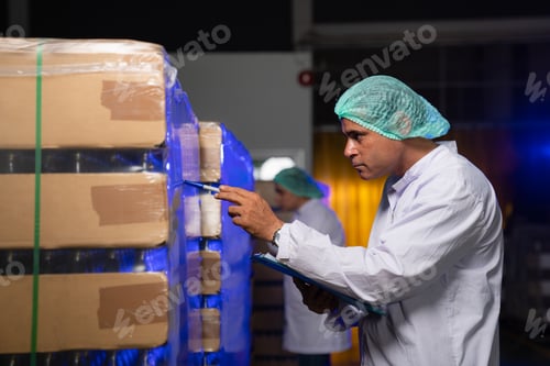 Preview: Man worker quality control a fruit drink factory in glass bottles