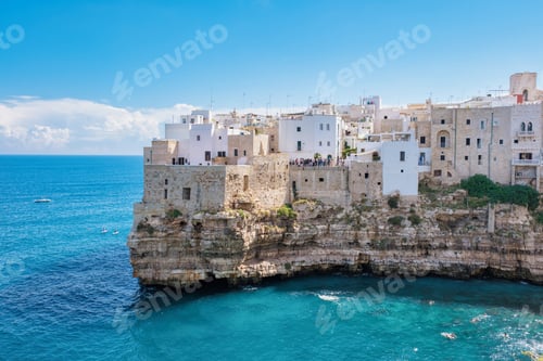 Preview: Explore the breathtaking coastal cliffs of Puglia, Italy, under a bright blue sky